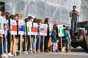 Zach Brown speaks during a Stand Strong for Climate rally in front of the Alaska State Capitol on Tuesday, Sept. 10, 2019 as students hold signs asking nations to divest from investments in the fossil fuel industry. (Michael Penn / Juneau Empire File)