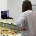 Second-grade teacher Katie Koskie Zooms with students on Friday, Sept. 4, 2020. Koskie fashioned a rig to elevate her computer to help with distance-delivered learning. (Ben Hohenstatt / Juneau Empire)