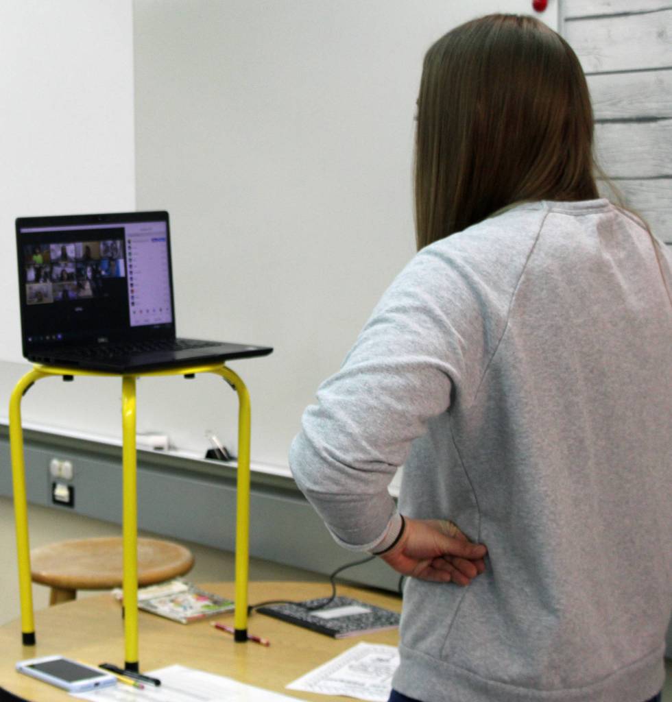 Second-grade teacher Katie Koskie Zooms with students on Friday, Sept. 4, 2020. Koskie fashioned a rig to elevate her computer to help with distance-delivered learning. (Ben Hohenstatt / Juneau Empire)