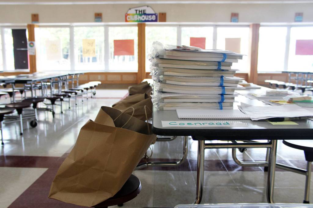 Learning bundles await pickup at Riverbend Elementary School on Friday, Sept. 4, 2020. Principal Elizabeth Pisel-Davis said the materials ensure that not all learning is done via screens. Materials include things such as sketch books and math manipulative materials  objects that allow students to work out match concepts with physical items. (Ben Hohenstatt / Juneau Empire)