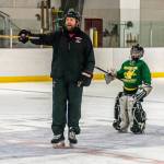 Matt Boline delivers instructions for an upcoming drill during a recent workout with players in the 12-and-under group workout at Treadwell Ice Arena. (Courtesy Photo / Steve Quinn)