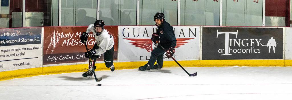 Coach Dave Kovach works with a player in the 14-and-under group. Kovach will help prepare the team when JDIA hosts the 14U, Division A state tournament next spring.