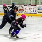 Youth hockey coach Randy Host plays freeze tag with a player competing in the 8-and-under age group. Its a favorite activity for this age group.
