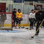 Matt Boline demonstrates a drill during a recent workout with players in the 12-and-under group workout at Treadwell Ice Arena. (Courtesy Photo / Steve Quinn)