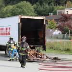 Firefighters respond to a vehicle fire on Hospital Drive the afternoon of Sept. 17, 2020. The cause of the brief blaze was an attempt to remove a liftgate, said Fire Marshal Dan Jager. (Ben Hohenstatt / Juneau Empire)