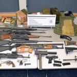 An Alaska man will appear in Canadian court on Sept. 21 after an incident entering Canada when border security officers seized the fourteen firearms pictured, alongside loaded magazines, ammunition, and other paraphernalia at a crossing southeast of Vancouver. (Courtesy photo / Canada Border Services Agency)