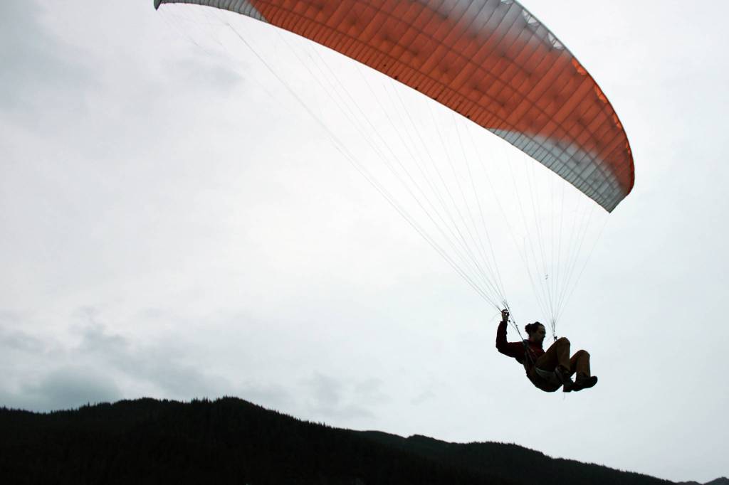 After a short bound, Greg Kopache floats back to earth on Sept. 22, 2020. (Ben Hohenstatt / Juneau Empire)
