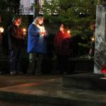 People gather for a candlelight vigil for the late Supreme Court Justice Ruth Bader Ginsburg near Dimond Courthouse on Saturday, Sept. 19. People shared remarks about some of Ginsburgs most famous decisions during the event. Some expressed hopes her seat would not be filled until after Election Day. (Ben Hohenstatt / Juneau Empire)