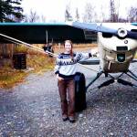 Tia Shoemaker, hunting guide and bush pilot on the Alaska Peninsula, stands next to her familys plane.(Courtesy Photo / Tia Shoemaker)