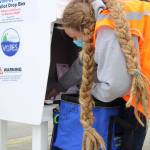 Deputy City Clerk Di Cathcart collects ballots from the ballot drop box at Don D. Statter Harbor the afternoon of Saturday, Sept. 19. Drop boxes located in Auke Bay and at the Douglas Public Library and Fire Hall are one of a few ways to vote in this years by-mail municipal election. (Ben Hohenstatt / Juneau Empire)
