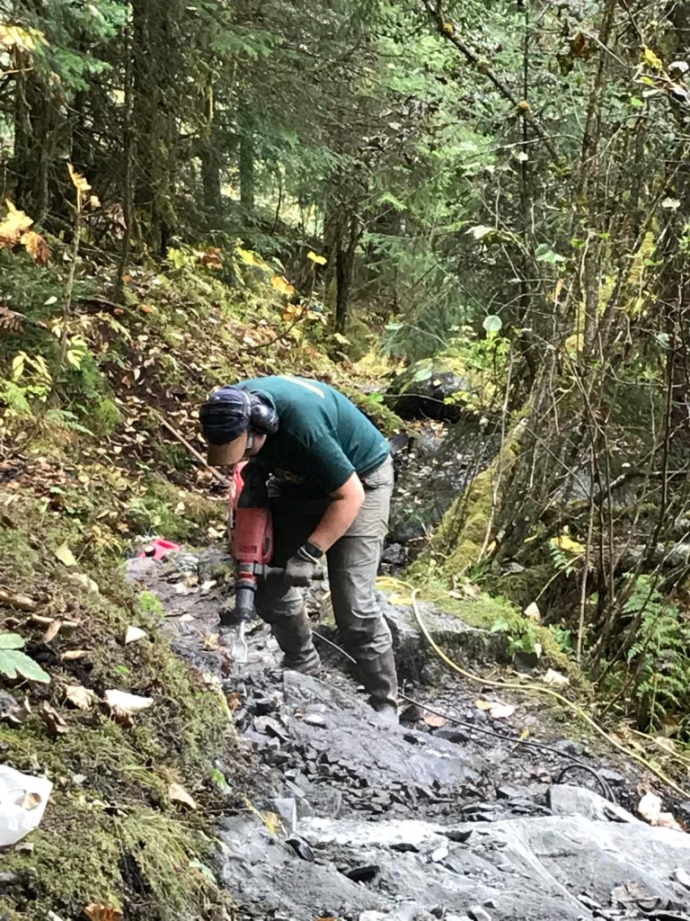 Destiny Locke, a member of the Forest Services trail crew, makes improvements to East Glacier Trail on Thursday, Sept. 24. I hike East GT weekly and am so grateful for the new steps cut into rock that make climbing easier for short legs, writes Laurie Craig. (Courtesy Photo / Laurie Craig)