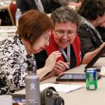 Juneau delegates Arlene and Ella Bennett use tablets at the 2019 Tribal Assembly in Juneau. Tablets were introduced last April to help with voting, and because this year&rsquo;s event is entirely virtual, Tlingit and Haida sent tablets to all 113 delegates in Alaska and the Lower 48. (Courtesy photo / Central Council of the Tlingit and Haida Indian Tribes of Alaska)