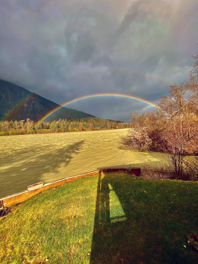 A double rainbow is seen on the Taku River on Oct. 5. The river was running high and muddy after days and days of heavy rainfall, writes Errol Champion. On that Monday afternoon there were sun breaks coupled with strong gusty winds that presented this view from my cabin which about three miles below the border with Canada. (Courtesy Photo / Errol Champion)