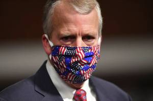 In this May 7, 2020 photo, Sen. Dan Sullivan wears a mask at a hearing in Washington. (Kevin Dietsch / Pool)