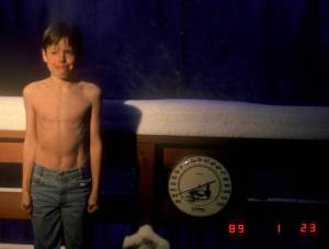 A 9-year-old Carl Tape — now a seismologist at UAF’s Geophysical Institute — poses beside a thermometer registering 50 below zero Fahrenheit during a Fairbanks cold snap in January 1989. (Courtesy Photo / Walt Tape)