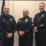 Juneau Police Department Chief Ed Mercer, left, and Deputy Chief David Campbell, right, pose with Sgt. Nick Garza, center, for Garza's promotion to sergeant on Oct. 14, 2020. (Courtesy photo / JPD)