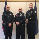 Juneau Police Department Chief Ed Mercer, left, and Deputy Chief David Campbell, right, pose with Sgt. Nick Garza, center, for Garza's promotion to sergeant on Oct. 14, 2020. (Courtesy photo / JPD)