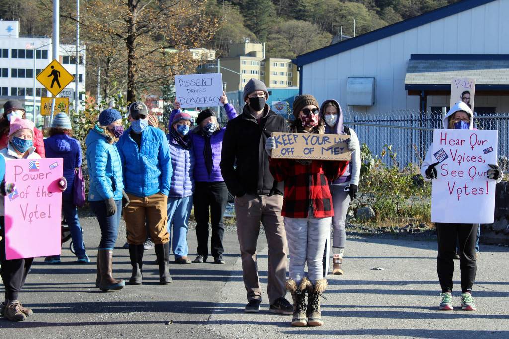 Many participants in Saturdays womens march held signs. Generally, the signs referenced the impending U.S. election or the nomination of Amy Coney Barrett to the U.S. Supreme Court. Rally-goers started at the Alaska State Capitol before walking to Mayor Bill Overstreet Park. (Ben Hohenstatt / Juneau Empire)