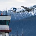 An Alaska Airlines cargo/passenger jet lifts off from the Juneau International Airport in this December 2014 photo. (Michael Penn / Juneau Empire FIle)