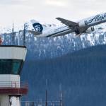 An Alaska Airlines cargo/passenger jet lifts off from the Juneau International Airport in this December 2014 photo. (Michael Penn / Juneau Empire FIle)