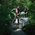 Trail Mix Inc. crewmembers Mark Krumwiede and Kim Ramos shovel Gravel on the Horse Tram Trail. (Trail Mix photo / Meg Roussos)