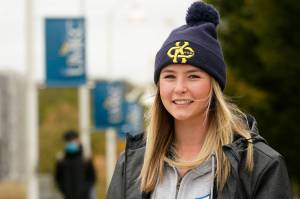 Madison Zurmuehlen poses for a photo on the University of Missouri-Kansas City campus in Kansas City, Mo., Friday, Oct. 23, 2020. Amid pandemic restrictions aimed at keeping students safe and healthy, colleges are scrambling to help them adjust. Zurmuehlen said daily practices, with masks, are “the one thing I look forward to,” so it was tough when campus sports were canceled for two weeks after an outbreak among student athletes and staff. (AP Photo / Orlin Wagner)