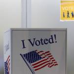 A voter fills out their ballot in person at the Mendenhall Valley Public Library on Oct. 6, 2020. The library was the site of one of the voting centers during the City and Borough of Juneau's by-mail municipal election. (Ben Hohenstatt / Juneau Empire)