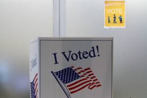 A voter fills out their ballot in person at the Mendenhall Valley Public Library on Oct. 6, 2020. The library was the site of one of the voting centers during the City and Borough of Juneau's by-mail municipal election. (Ben Hohenstatt / Juneau Empire)