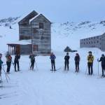 The Juneau Nordic Ski Team circles up at Hatcher Pass during an early season team training retreat in 2019. (Courtesy photo / Jeannie Monk)