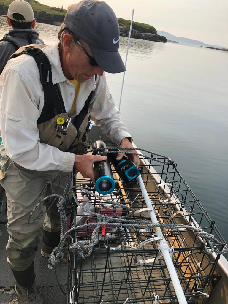 Prepping an underwater camera on Lake Iliamna. Courtesy Photo / Mark Stigar)