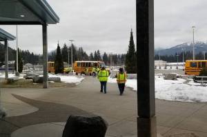 First Student employees load meals on school buses so the meals can be distributed to Juneau youths. (Courtesy Photo / Juneau School District)