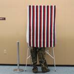 A man votes takes advantage of early voting at the Mendenhall Mall on Oct. 22, 2020. The FBI issued public guidance ahead of the general election warning voters about what is and isnt federal election crime, and how to report such crimes if theyre spotted. (Ben Hohenstatt / Juneau Empire)