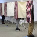 Nearly every voting booth is occupied at a polling place in Nugget Mall on Nov. 3, 2020. (Ben Hohenstatt / Juneau Empire)
