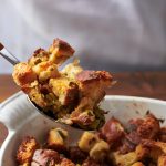 This August 2020 photo shows a recipe for traditional Thanksgiving stuffing in New York. The recipe can be cut in half and baked in a smaller pan for less time for a smaller group. (Katie Workman via AP)