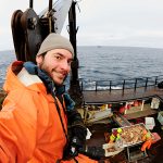 Chris Miller photographing the Bering Sea crab fishery. (Courtesy Photo / Chris Miller)