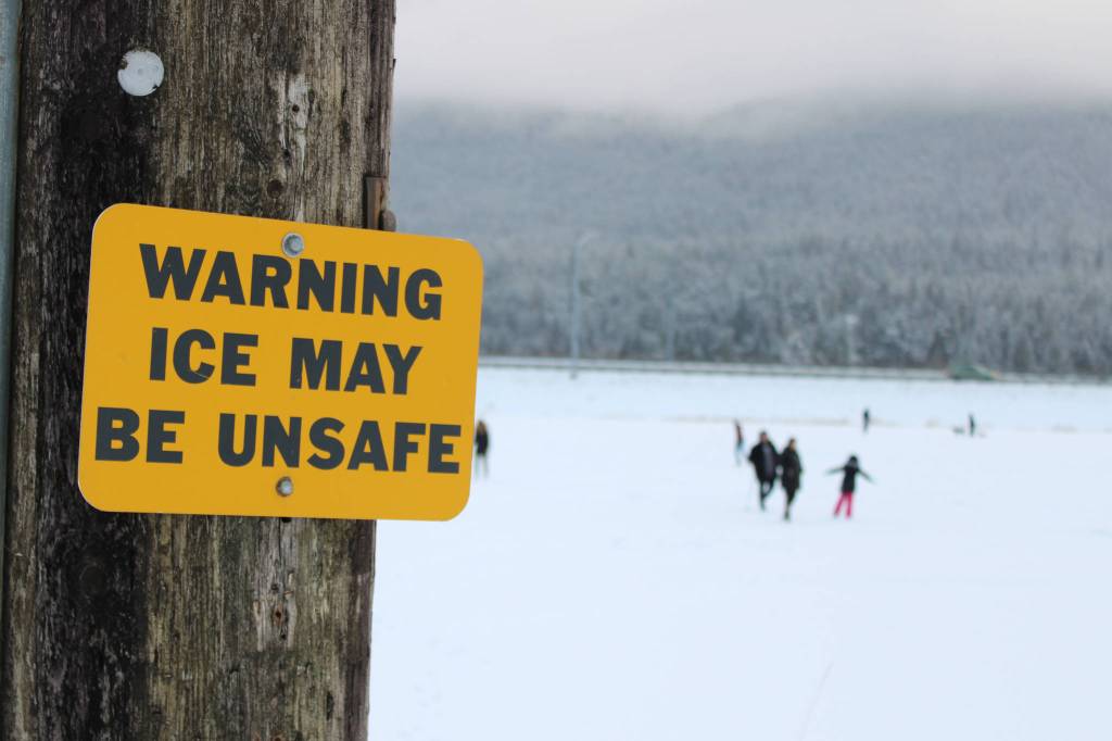 Many residents took to the ice at Twin Lakes as well as the parks snow-covered hills Friday, Nov. 20. (Ben Hohenstatt / Juneau Empire)