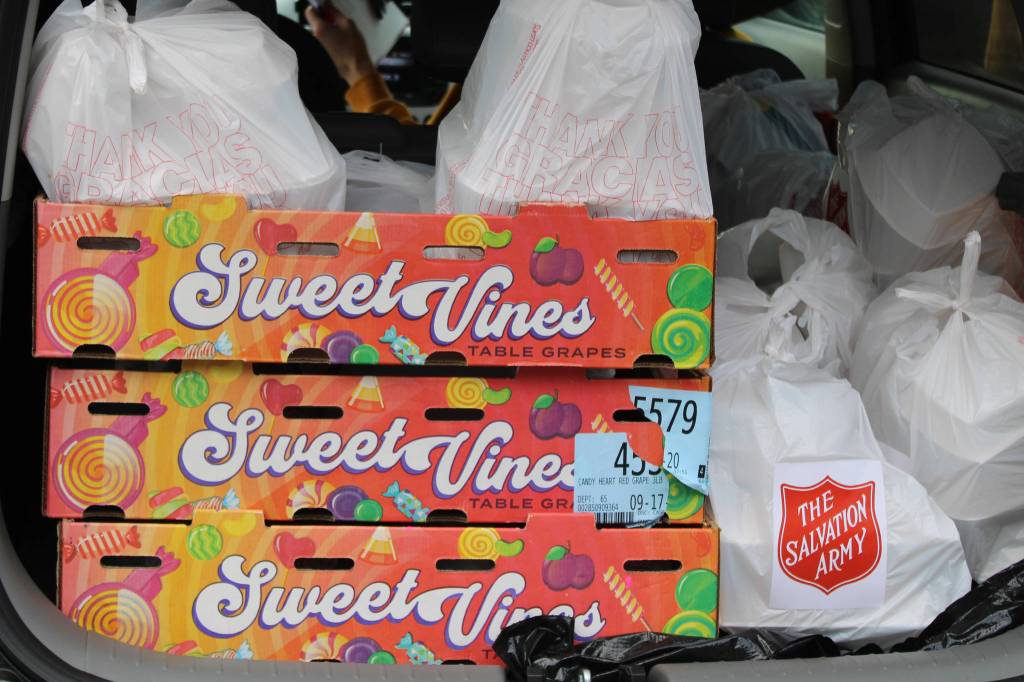 A trunkload of meals is destined for seniors and unsheltered Juneauites. (Ben Hohenstatt / Juneau Empire)