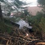 Michael S. Lockett / Juneau Empire
A bus landed on the roof of a house on Out the Road after driving off the road on Thursday. The bus and house were empty, and the driver of the bus was uninjured.