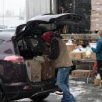 Head volunteer organizer Maureen Hall coordinates loading the Gianotti car with 10 baskets to deliver.(Courtesy Photo)