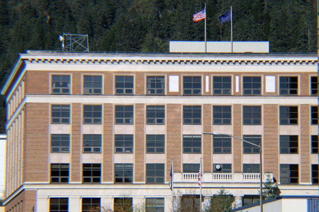 Ben Hohenstatt / Juneau Empire File
The U.S. Flag and Alaska state flag fly on the roof of the Alaska State Capitol on Oct. 17. With just over a month before legislative session is set to begin, some lawmakers are waiting to lock down digs. One factor: uncertainty about how  and for how long  lawmakers plan to meet.