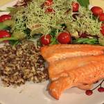This photo shows salmon, quinoa and salad. (Vivian Mork Yéilk / For the Capital City Weekly)