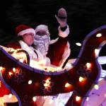 Ben Hohenstatt / Juneau Empire
Santa Claus waves to Juneau residents who gatheredat a distanceto watch a holiday parade on Dec. 18.