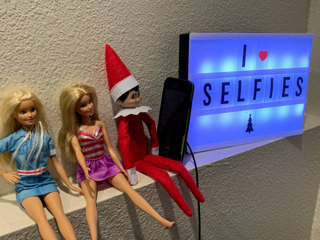 Courtesy Photo / Angela Boyd
Twizzle the Elf takes selfies with his new Barbie friends.