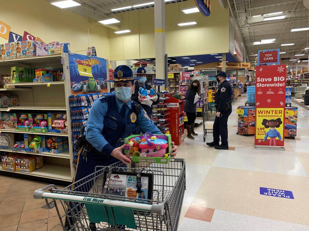 Alaska State Troopers shop for Juneau families at Fred Meyer on Dec. 21, 2020 as part of the Alaska Police Officer Associations annual Shop with a Cop event for Christmas. (Courtesy photo / Alaska State Troopers)