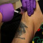 Arsenio Pastor Credo receives the Moderna coronavirus vaccine from nurse Courtney Taber at the Southeast Alaska Regional Health Consortiums Ethel Lund Medical Center on Dec. 24, 2020. Hes one of the first non-healthcare professionals to be vaccinated. (Michael S. Lockett / Juneau Empire)