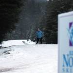 Allison Smith, a member of the Juneau Nordic Ski Club, passes another skier on her way along Montana Creek Road. Ski trails around Juneau will soon be hiding clues for Juneau Nordic Ski Club's ski-o’cache event. (Ben Hohenstatt/Juneau Empire)