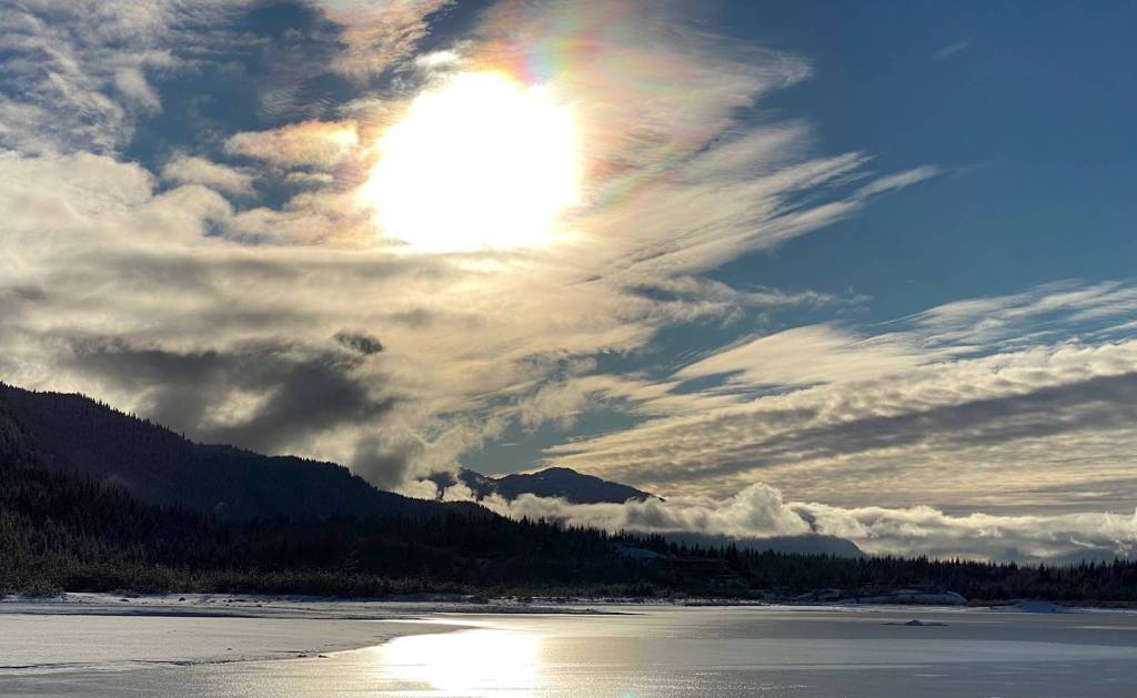 The sun wins the battle with the clouds over Mendenhall Lake on Jan. 25. (Courtesy Photo / Denise Carroll)