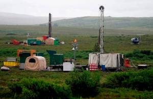 In this July 13, 2007, file photo, workers with the Pebble Mine project test drill in the Bristol Bay region of Alaska, near the village of Iliamma. (AP Photo / Al Grillo)