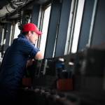 Capt. Bill Woityra, the commanding officer of the Coast Guard Cutter Polar Star looks out from the cutters bridge, Thursday, Dec. 17, 2020, while underway in the Bering Strait. The icebreaker is supporting an increasingly prioritized mission in the region, according the the Coast Guard. (Petty Officer 1st Class Cynthia Oldham / USCG)