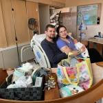 Kevin McCallister and Alexus Forehand smile with their recently born daughter, Madelynn Rose. The McCallisters of Skagway are the parents of the first baby born at Bartlett Regional Hospital in 2021. (Courtesy Photo / BRH)